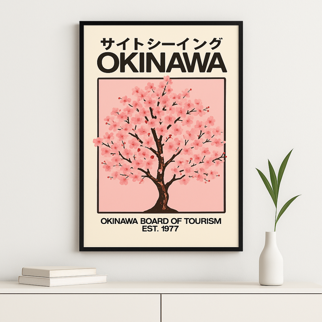Framed poster of a cherry blossom tree with 'Okinawa' text on a beige background, displayed on a wall.