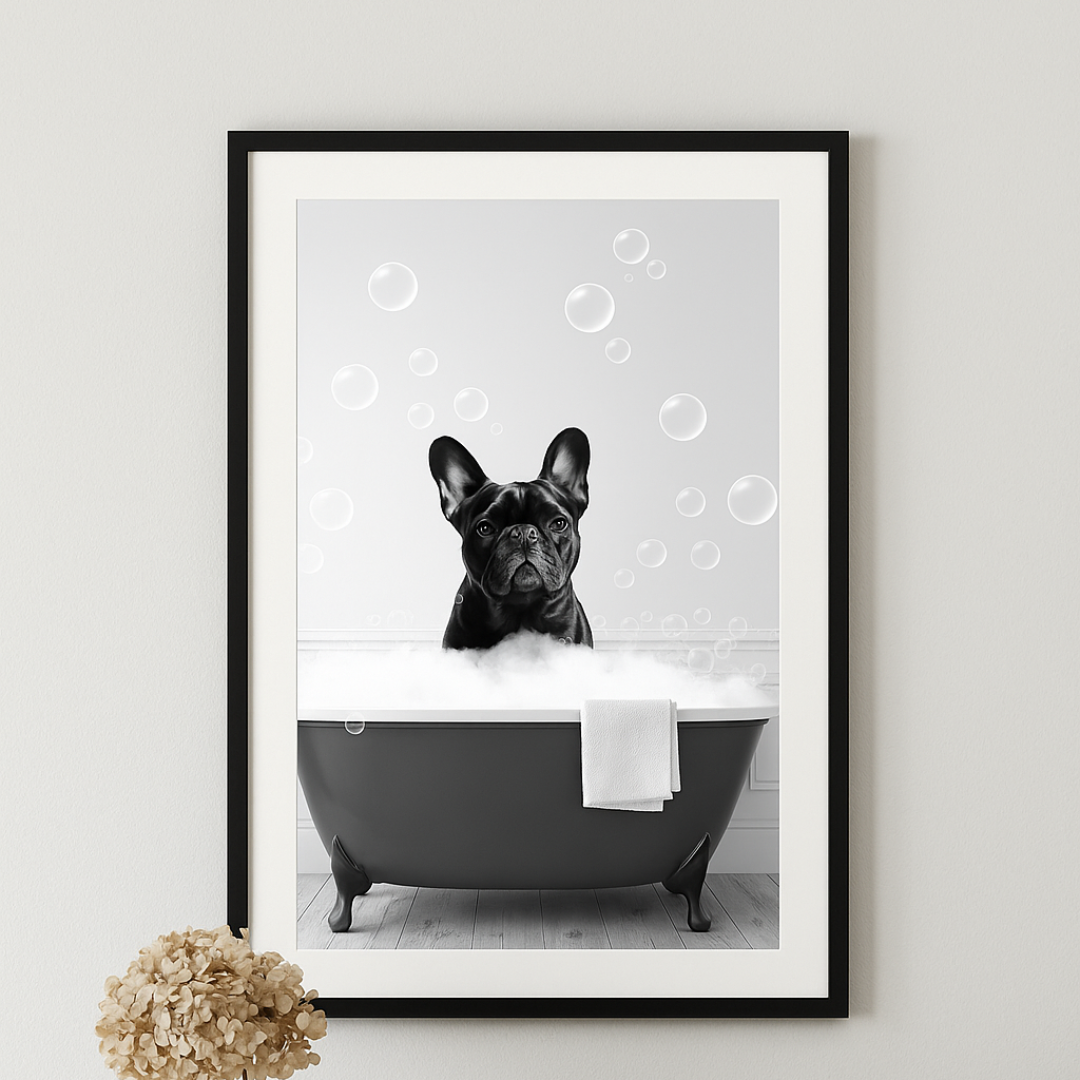 Framed artwork of a dog in a bathtub with bubbles on a wall above a wooden console table.